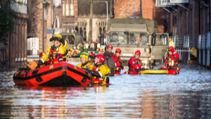 rescuers in dinghies on flooded York street 