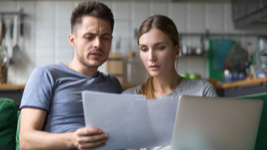 couple looking at financial paperwork