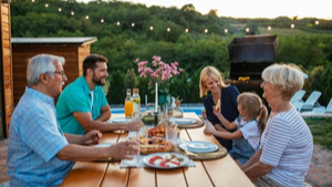 multigenerational family enjoying an outdoor meal