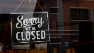 a shop “sorry we’re closed” sign